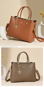 Stylish women soft leather handbag with shoulder strap and elegant flower charm for daily use.
