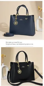 Stylish women's leather handbag with shoulder strap and elegant floral pendant accessory.