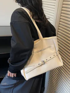 Vintage cream soft leather tote bag with large capacity, shown on model shoulder.