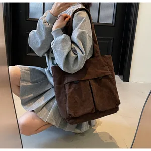 Retro brown corduroy shoulder bag, large capacity tote handbag with multi pockets for women daily commute.