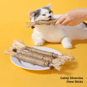Close-up view of a cat biting a natural matatabi stick toy with raffia and gall fruit details
