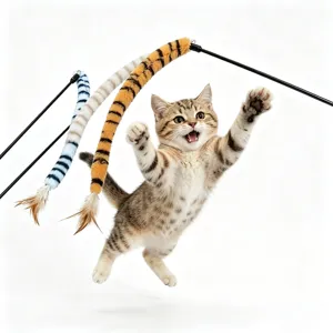 Playful kitten jumping to catch a retractable cat teaser wand with tiger stripes