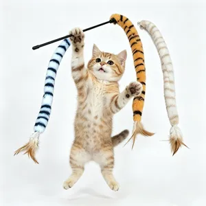 Action shot of a kitten jumping to catch a retractable tiger-striped feather cat wand