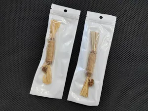 Detailed view of two cat silvervine molar sticks in individual white packaging