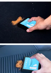 Close-up detail showing the handheld pet hair remover brush cleaning fur off a blue car seat
