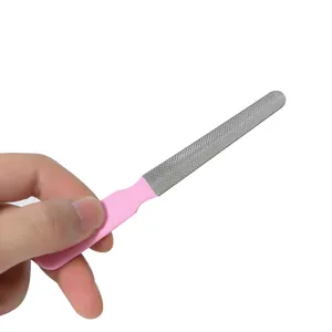 Detail view of a professional pet nail file with pink handle and textured metal surface.