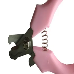 Detailed macro view of pink pet nail clippers with sharp steel blades and spring mechanism