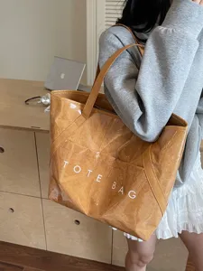 Große Dupont-Papier-Tragetasche mit klarer PVC-Schicht und weißem Tote Bag-Aufdruck.
