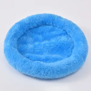 Close-up macro view of a soft blue plush circular warm bed for hamsters and small pets