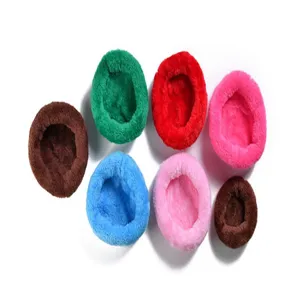 Close-up of variety of multi-colored thick plush warm beds for small pets in winter