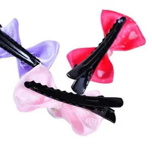Lot de barrettes à nœuds colorées pour animaux de compagnie avec motif de cœur.
