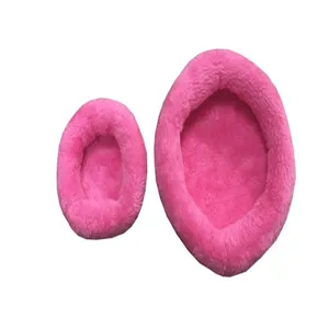 Two sizes of pink plush winter warm beds for hamsters or small pets on white background.