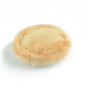Close-up of a cozy warm plush small pet bed with soft thick beige faux fur for hamsters