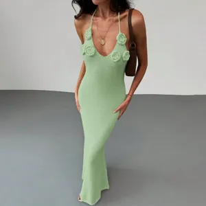 Green knit halter maxi dress featuring chic 3D crochet flowers, elegant sleeveless detail style