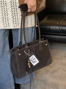 Vintage brown large capacity tote bag with stitched details for elegant daily commute