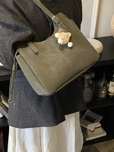 Large olive green soft leather tote bag with elegant embroidery details for women