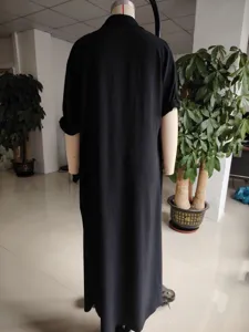Black long sleeve shirt dress detail view, casual loose fit solid color maxi dress for women.