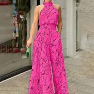 Detailed view of the stylish pink halter neck jumpsuit featuring abstract black line art print.