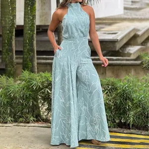 Mint green halter wide leg jumpsuit with chic abstract white line print for summer fashion wear