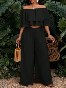 Schwarzes schulterfreies rüschen crop top und high-waist palazzo hosen zweiteiler set für damen
