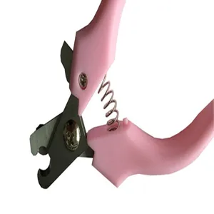 Close-up of pink pet nail clippers with sharp stainless steel blades and spring mechanism