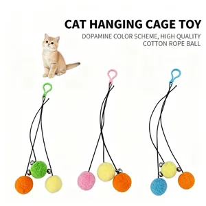 Close-up of cat hanging cage toy with colorful plush balls and small bells.