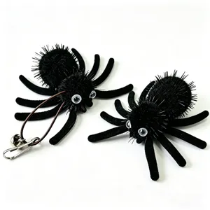 Fuzzy black Halloween spider cat toy with elastic cord and bell detail