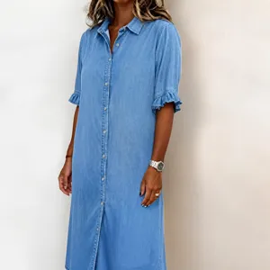 Detail shot of a casual light blue denim shirt dress for women, featuring a button-down front.