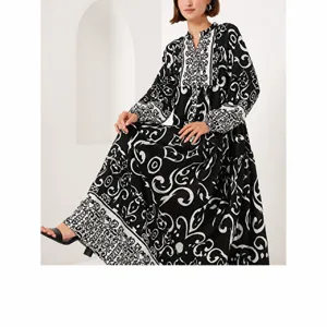 Elegant black and white embroidered long cardigan robe detail showing exquisite pattern design.