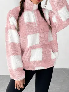 Pink and white checkered half-zip plush sweatshirt detail, cozy autumn winter pullover.