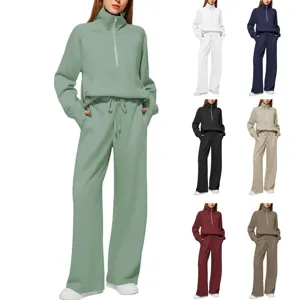 Detailed view of the women half-zip sweatshirt and wide leg sweatpants tracksuit set.