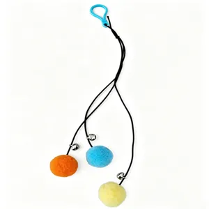 Detailed view of hangable cat teaser toy with three colorful fuzzy balls and bells