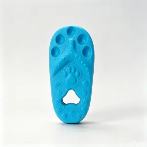 Blue silicone pet chew toy detail, slipper shape with cute paw print textures for dogs.