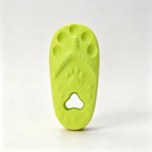 Green slipper shaped pet chew toy detail, cute paw print texture and hole design.