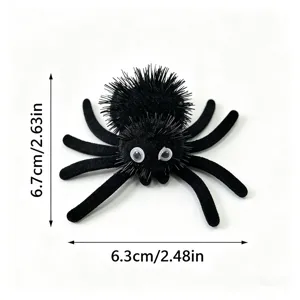 Close-up detail showing the dimensions of a fuzzy black Halloween spider toy for cats