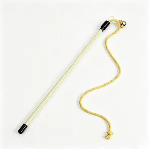 Close-up details of the cat teaser wand featuring a yellow rope, stick and a small bell.