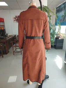 Brown suede long trench coat for women with black belt and lapel collar design style.