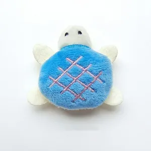 Close-up detail of cute plush turtle cat toy, soft texture with embroidered shell.