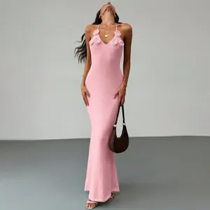 Pink knit halter maxi dress with crochet flowers, elegant detail view of the beach cover-up.