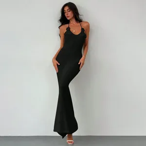 Sexy black knit halter maxi dress with floral detail for beach and casual summer wear.