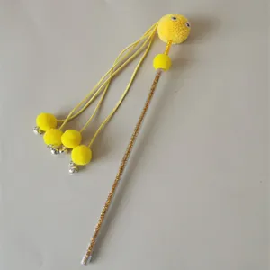 Interactive cat teaser wand toy with yellow pom poms and bell, perfect for pet playtime entertainment.