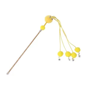 Detailed close-up view of the yellow plush cat teaser wand with sparkling stick and bells.