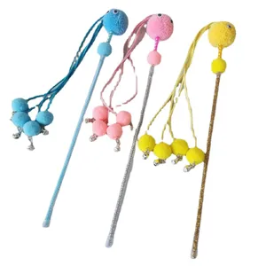 Interactive colorful plush cat teaser toy with bells and fuzzy balls for pet entertainment.