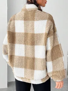 Brown white plaid fuzzy fleece half zip sweatshirt detail view showing soft textured fabric.