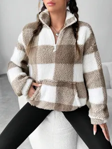 Detail view of women brown white plaid fuzzy half-zip fleece sweatshirt cozy winter top.