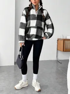 Detailed shot of women black and white plaid quarter zip sherpa fleece pullover sweatshirt.