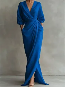 Stunning royal blue V-neck long sleeve maxi dress featuring elegant wrap waist and side pockets.