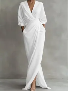 White V-neck long sleeve wrap dress, casual resort style waist-cinching maxi dress.