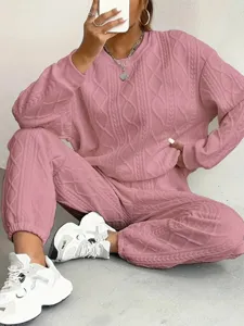 Pink ribbed knit tracksuit for women, casual long sleeve sweater and matching jogger pants set.