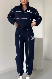 Women navy blue zip-up sweatshirt and sweatpants track suit set with white piping.